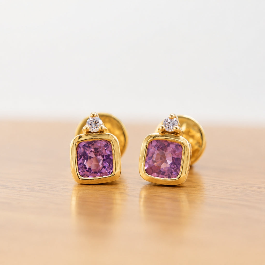 Side view of handcrafted 14K gold pink spinel and diamond stud earrings with butterfly backs.