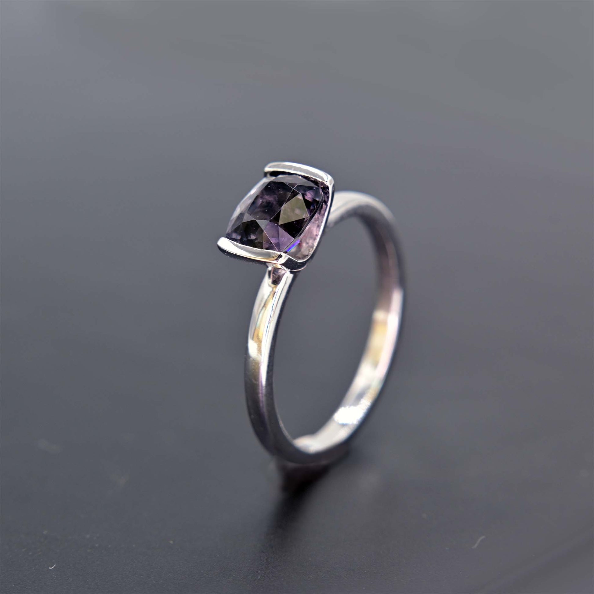 Angle view of grey spinel ring
