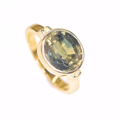 Round green sapphire bezel set ring handcrafted in solid 14K gold