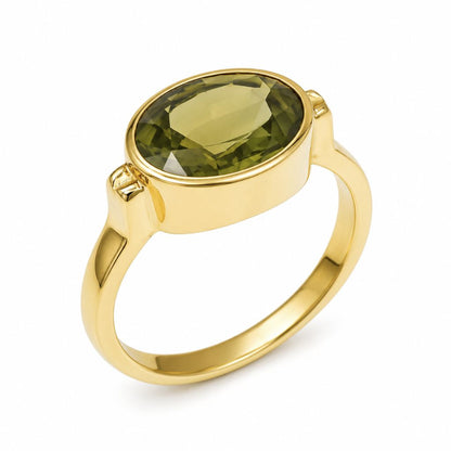 Luxury 3.70 carat Thai green sapphire bezel ring in 14K yellow gold showcasing a rare natural oval gemstone.