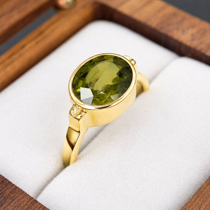 Elegant oval Thai green sapphire ring with a 3.70 carat natural gemstone in handcrafted 14K yellow gold for everyday luxury.