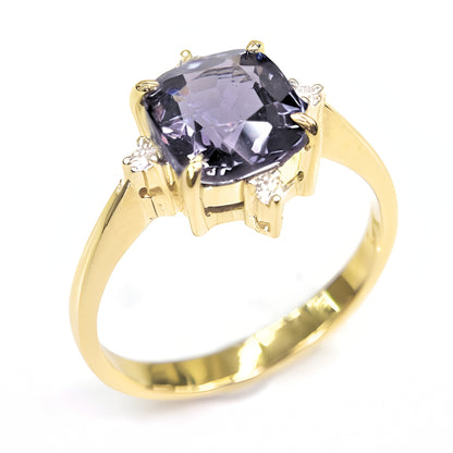 A macro shot focusing on the precise craftsmanship of the ring, from the secure setting of the diamonds to the smooth, polished finish of the gold band.