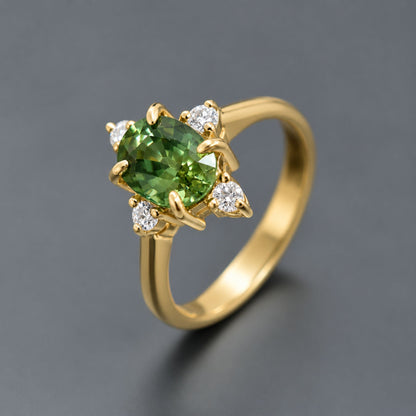 Handcrafted green sapphire engagement ring with diamond accents in yellow gold from Thailand
