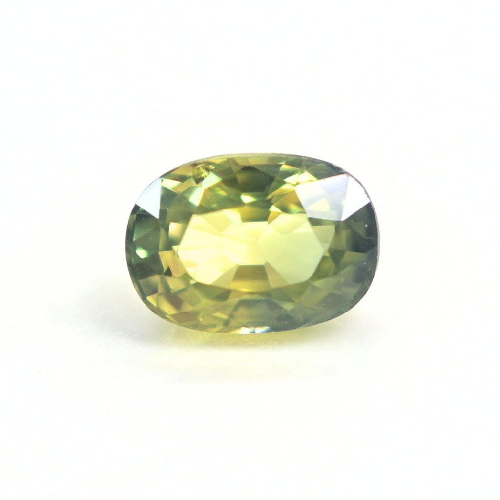 1.19 carat unheated oval-cut natural Thai green sapphire viewed from the top showing rich forest-green color.