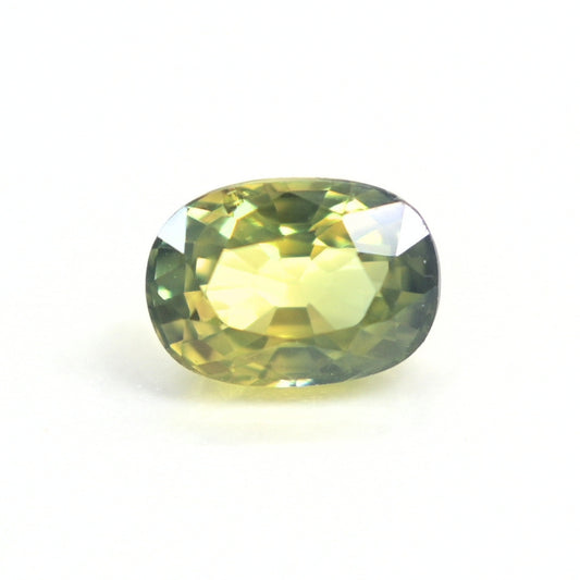 1.19 carat unheated oval-cut natural Thai green sapphire viewed from the top showing rich forest-green color.