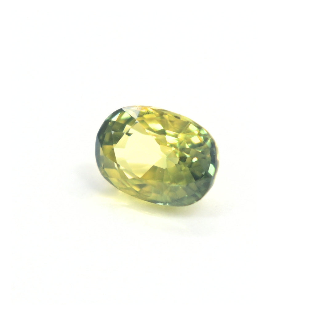 Close-up of a 1.19 carat untreated oval green sapphire from Thailand displaying excellent clarity and brilliance.