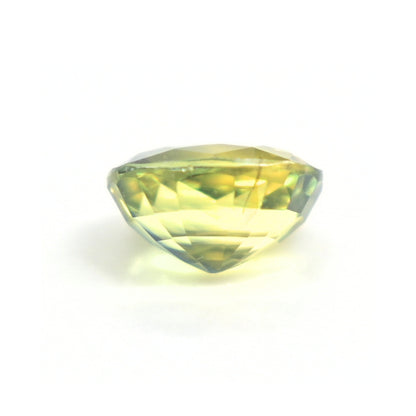 Natural unheated Thai green sapphire weighing 1.19 carats photographed at an angled view highlighting its oval cut.