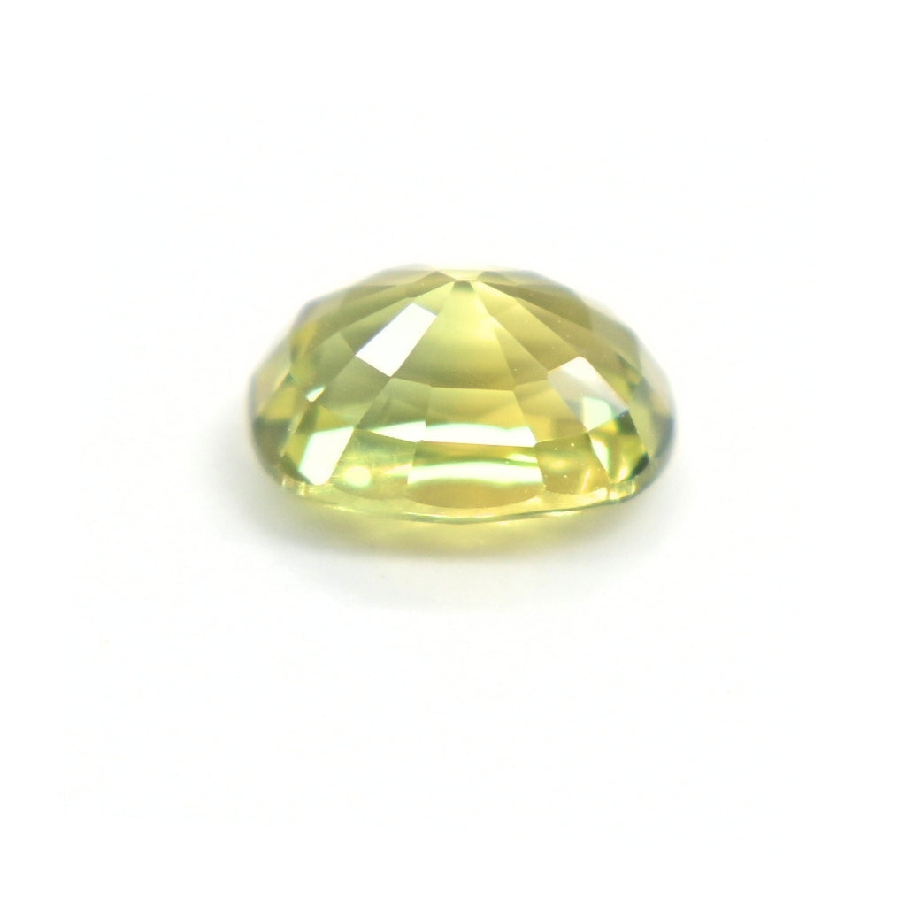 Side profile of a 1.19 carat oval-cut green sapphire showing natural color and precision faceting.