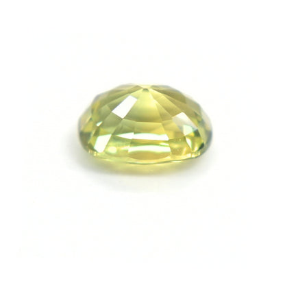 Side profile of a 1.19 carat oval-cut green sapphire showing natural color and precision faceting.