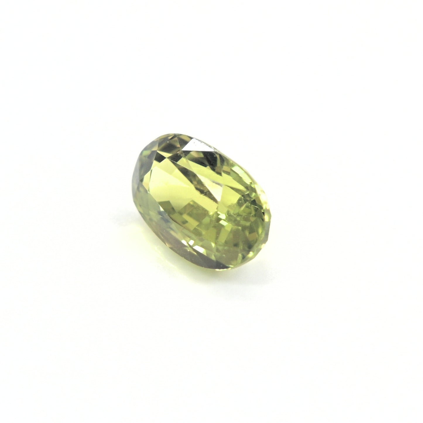 Natural green sapphire 1.64ct unheated oval gemstone on white background