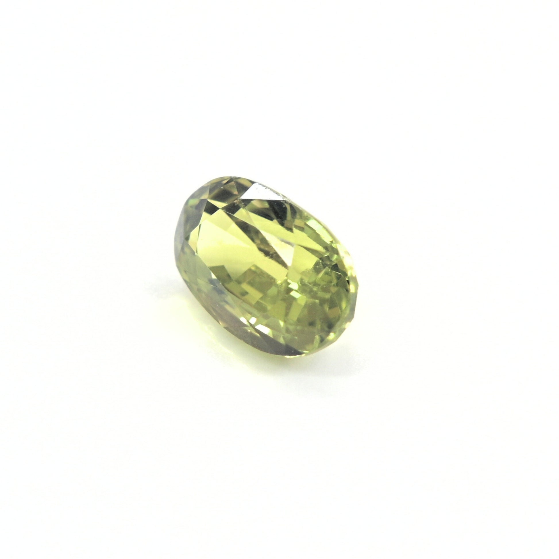 Natural green sapphire 1.64ct unheated oval gemstone on white background