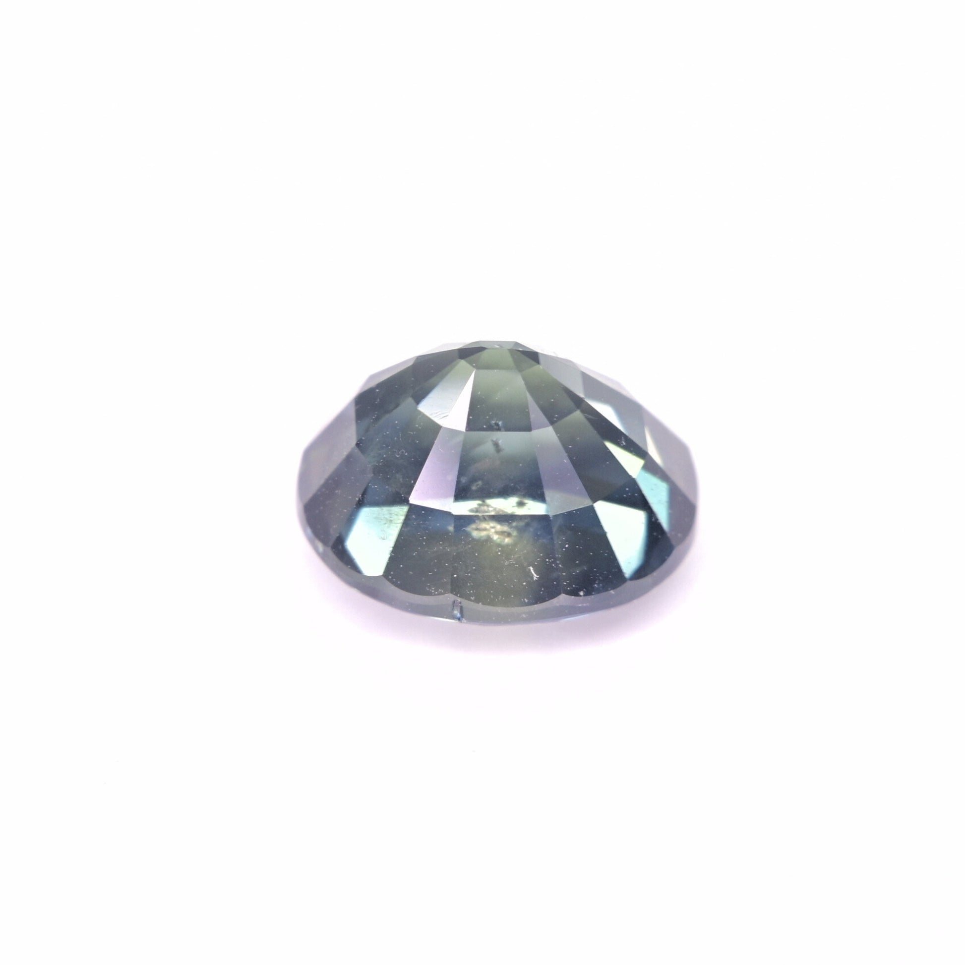 Loose unheated teal sapphire oval cut showing natural brilliance 4.02 carat