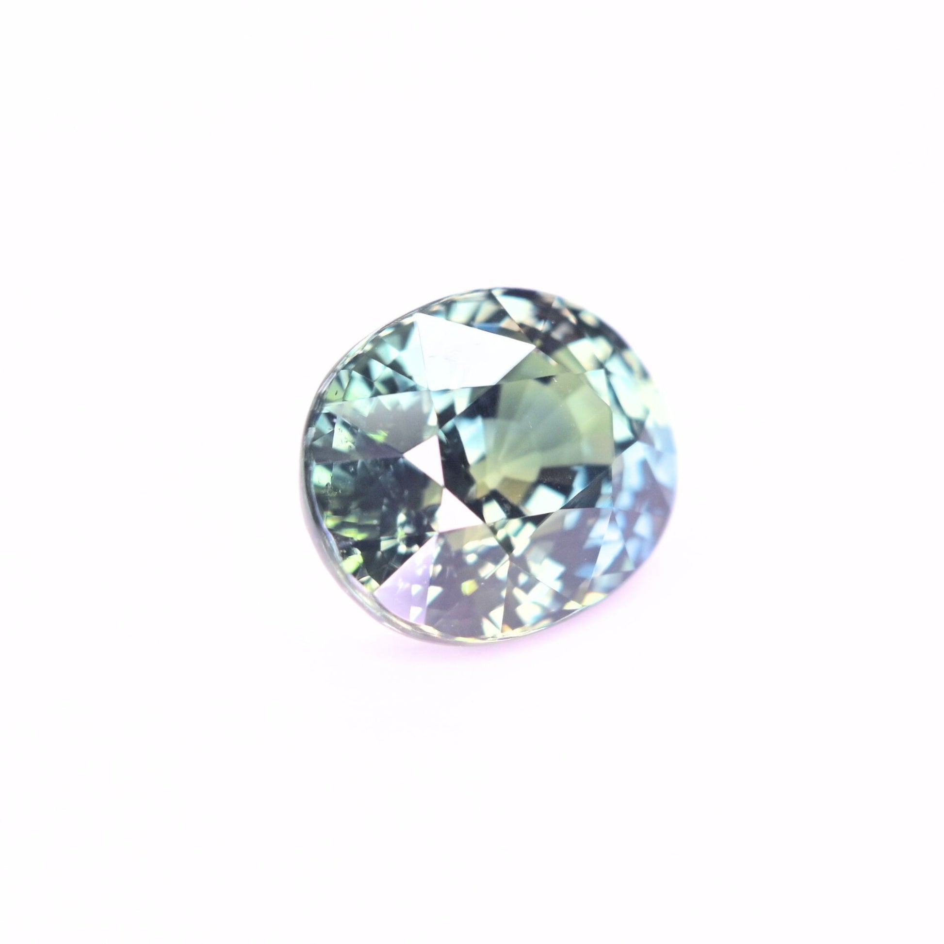 Natural unheated sapphire 5.03 carat oval teal gemstone close-up
