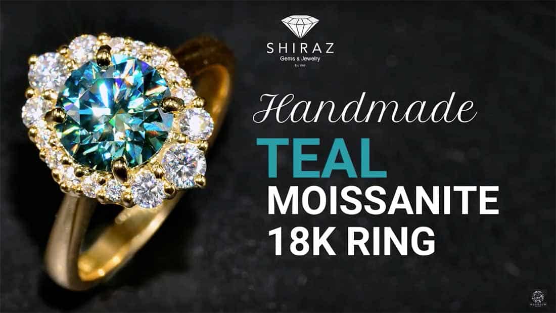 Load video: Handmade teal moissanite ring in 18K yellow gold