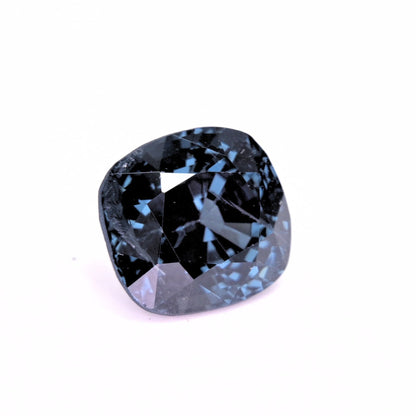 close up of cushion cut blue spinel 3.95 carat with inclusions visible
