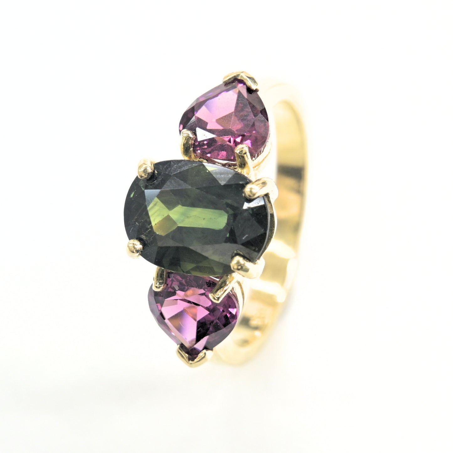 Handcrafted gold ring set with green sapphire and pear-cut rhodolite gemstones