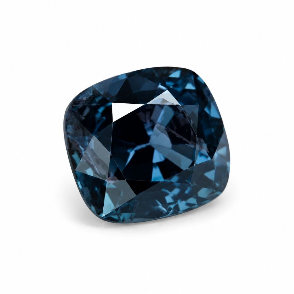 Natural unheated blue spinel loose gemstone in cushion cut, rich steel-blue color from Shiraz Jewelry Chiang Mai.