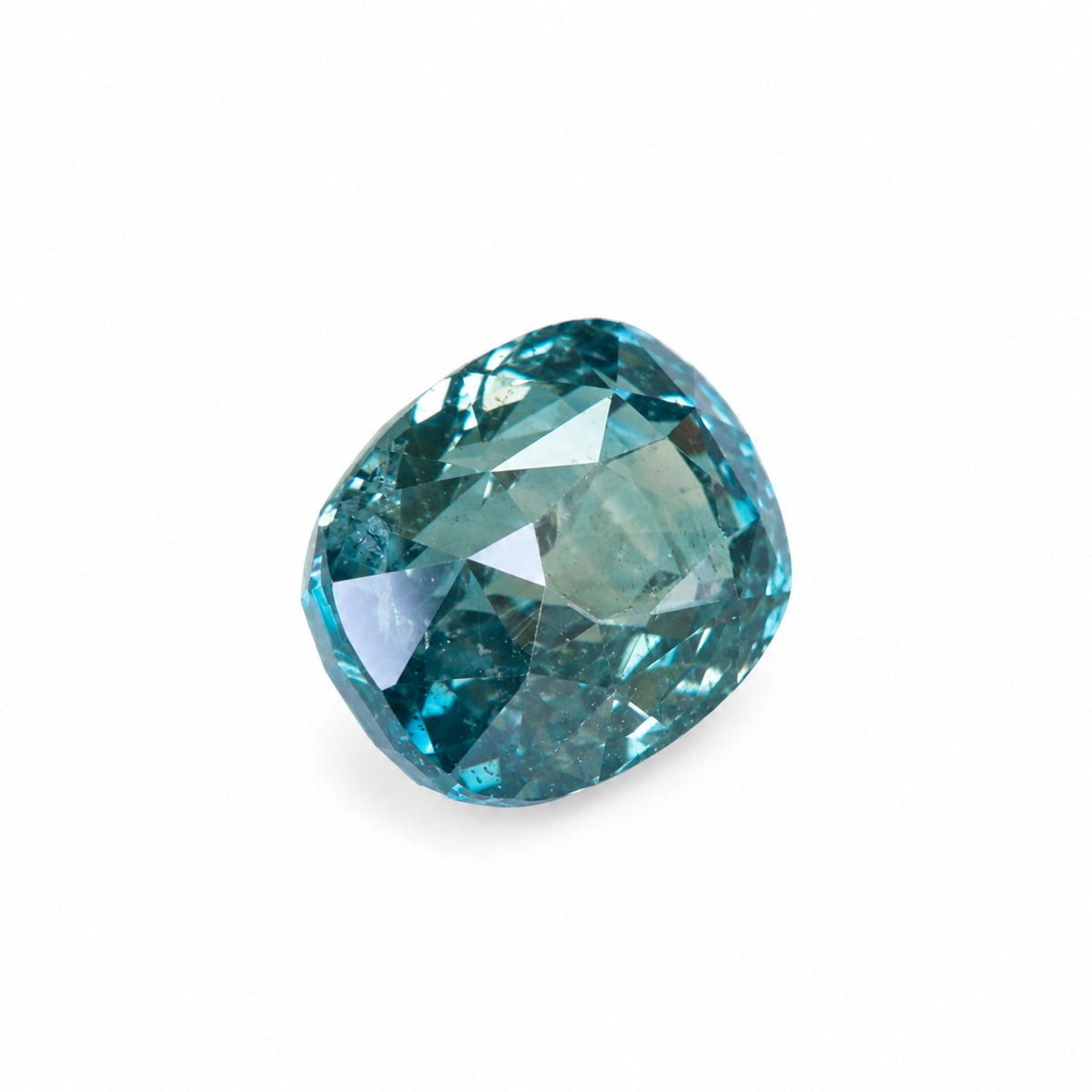Profile angle of a 2.13 Carat unheated teal sapphire loose gemstone demonstrating pavilion depth and light refraction.