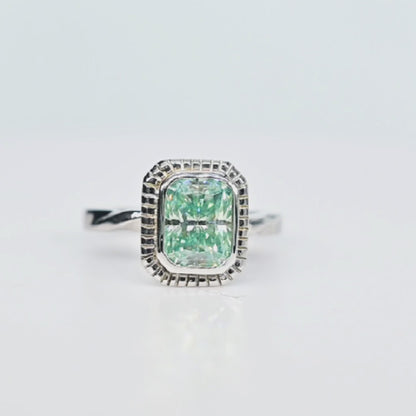 Round view of the teal moissanite handmade ring in 18K