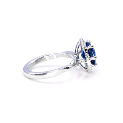 Unique sapphire ring in 18K white gold, handcrafted with oval sapphire and diamond accents
