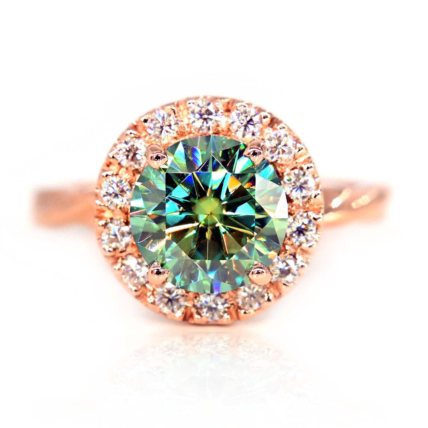 Stunning engagement ring made with 14k rose gold and teal moissanite. Made in Chiang Mai, Thailand and delivered worldwide!