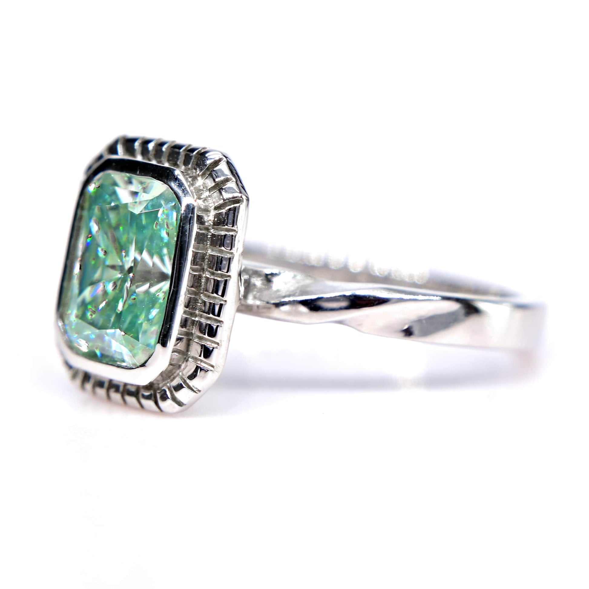 Shiraz Jewelry blue green moissanite ring with white gold band and cushion-cut stone