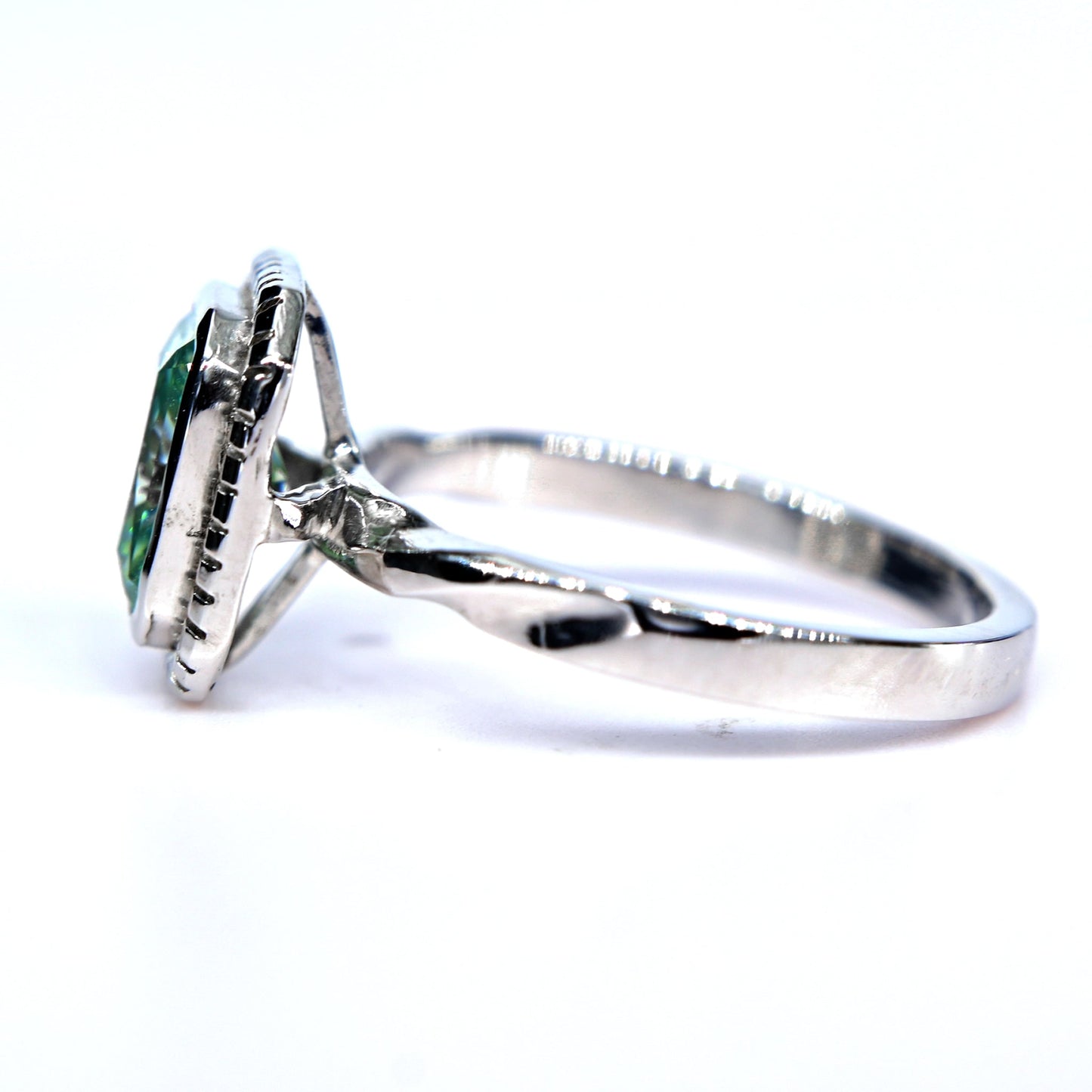 Shiraz Jewelry blue green moissanite ring with twisted white gold band and bezel setting
