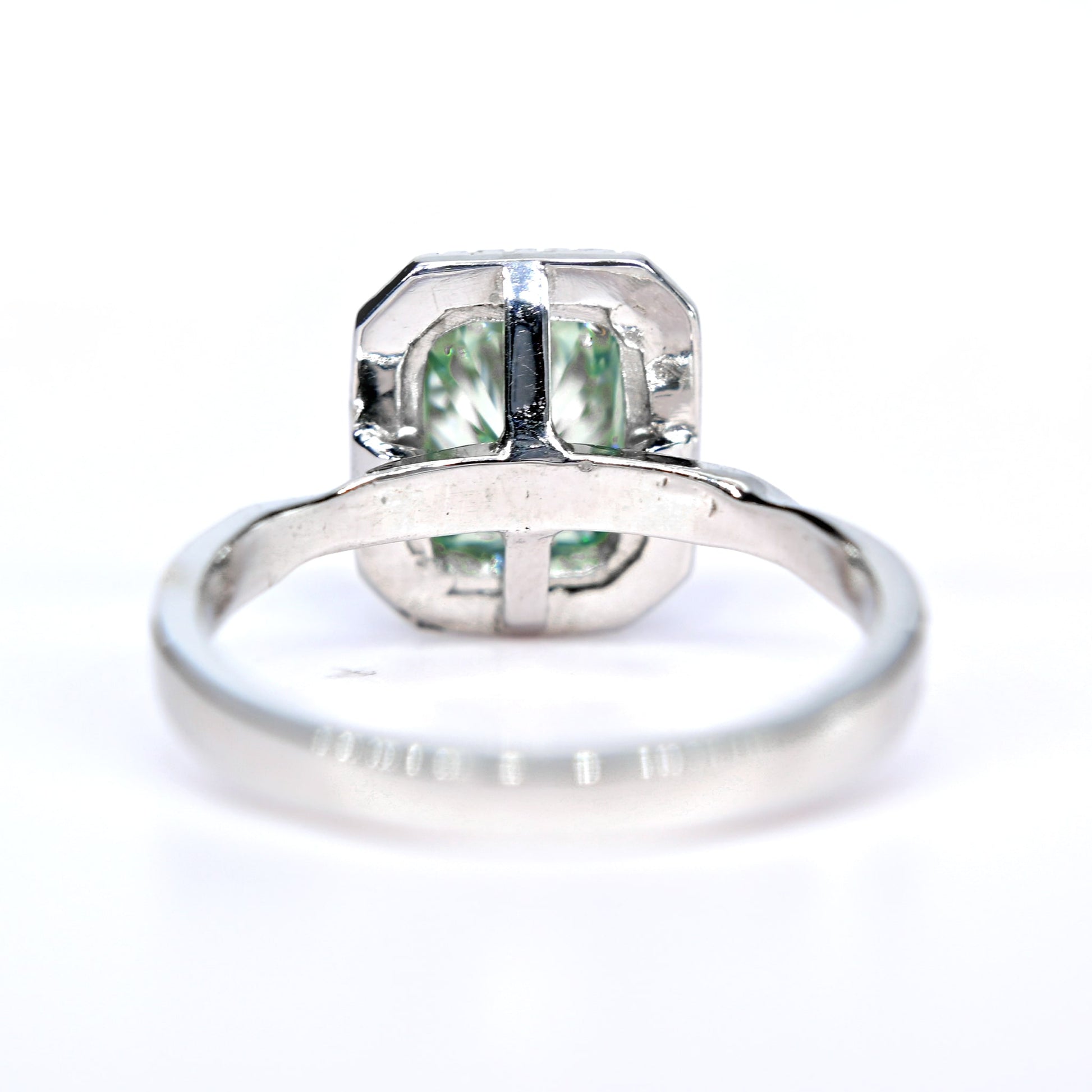 Shiraz Jewelry blue green moissanite ring with a white gold band and emerald cut gemstone